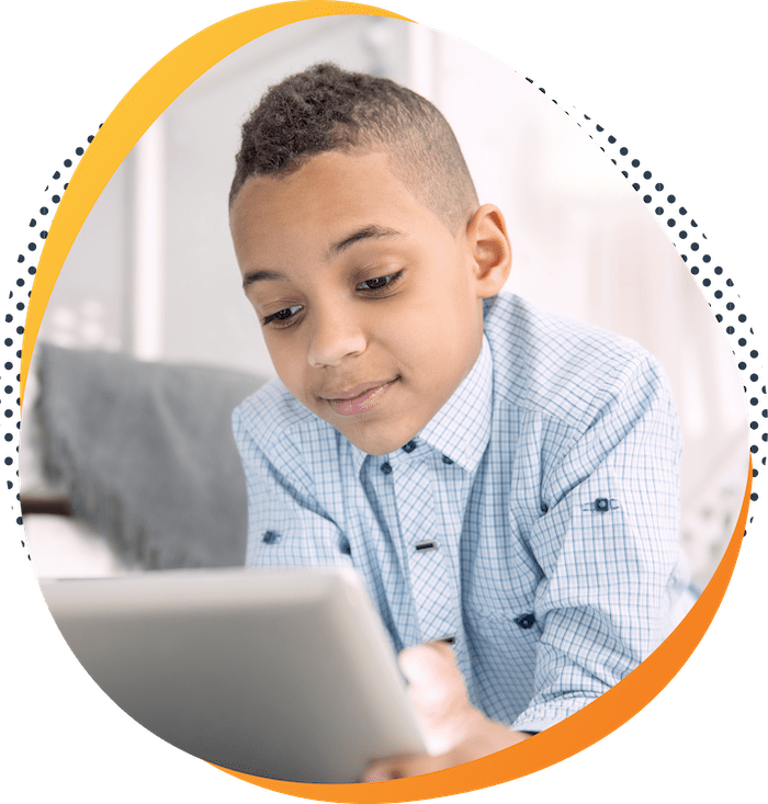 Boy with tablet using DreamBox